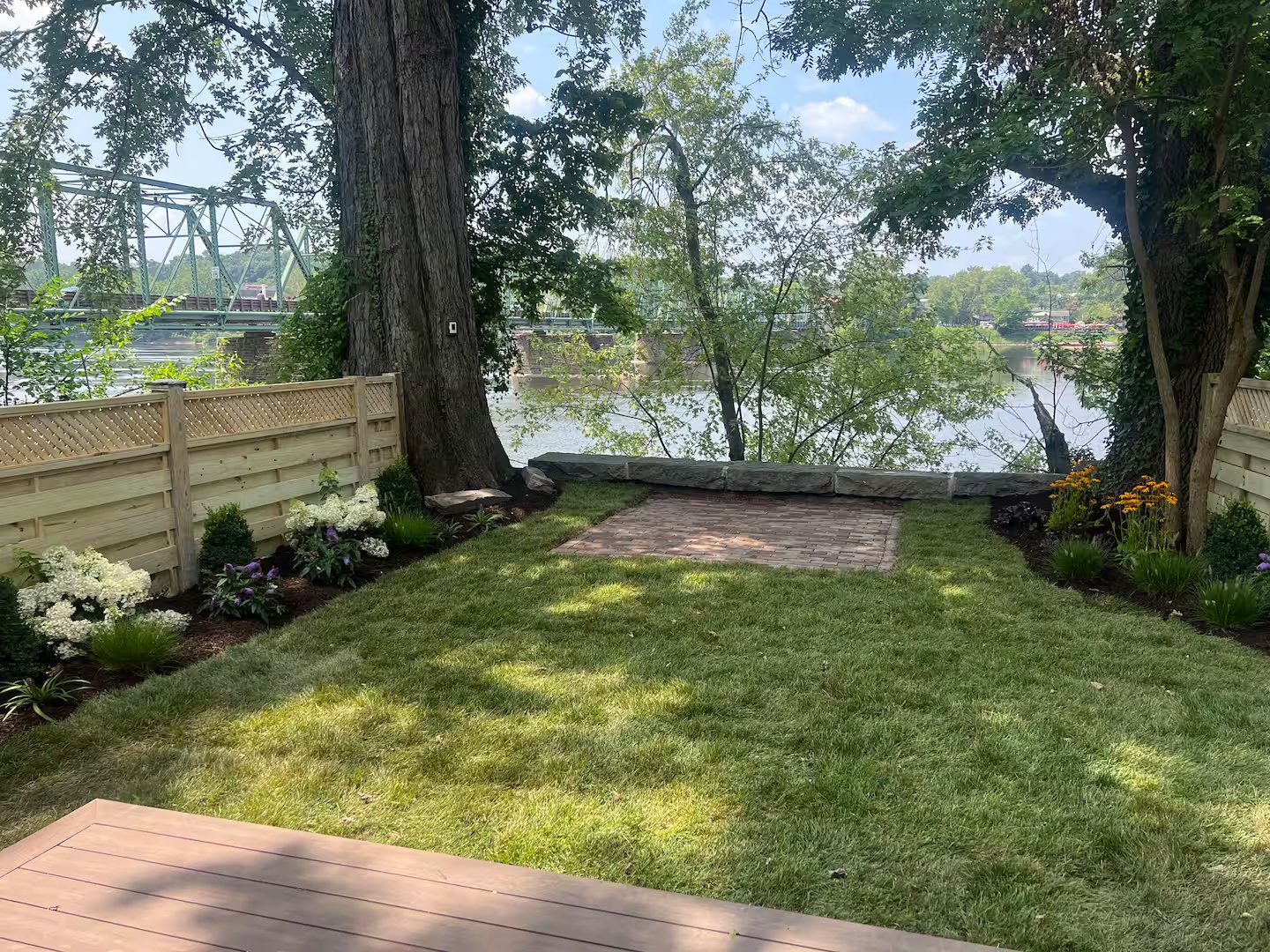 The Garden Level — hero backyard bridge